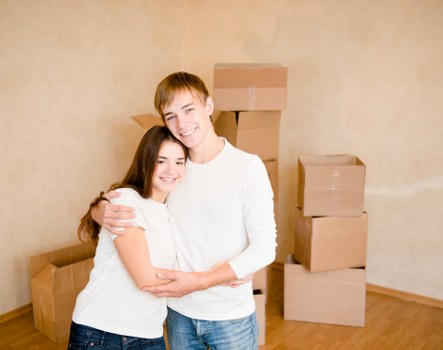 Professional movers loading a van