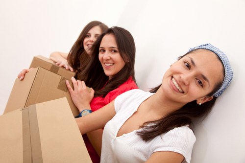 Professional movers loading items into a moving van