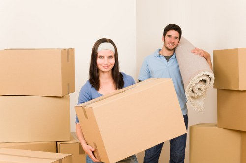 Professional movers handling furniture in a van