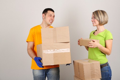 Professional movers preparing a van for relocation in Camden